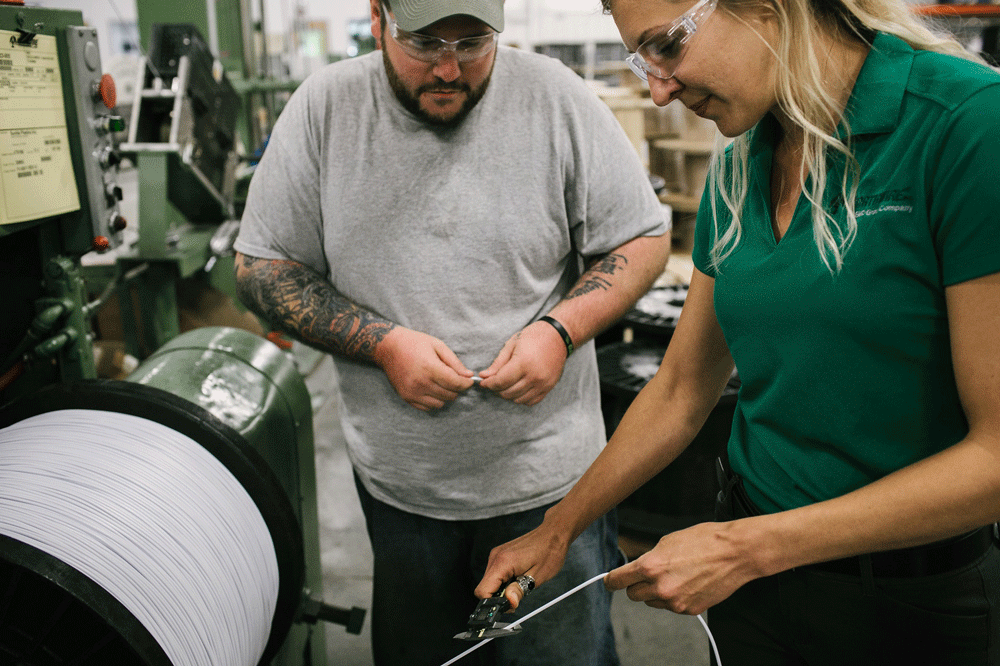 Two Northwire engineers working on custom cable solutions in a factory